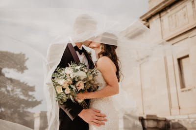 woman holding roses at glamorous event