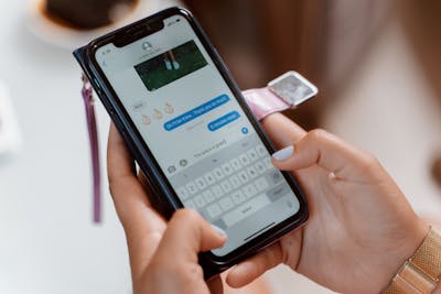 woman taking selfie with phone