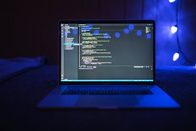 person using laptop with creative software on screen
